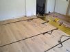 Solid wood flooring strapped together