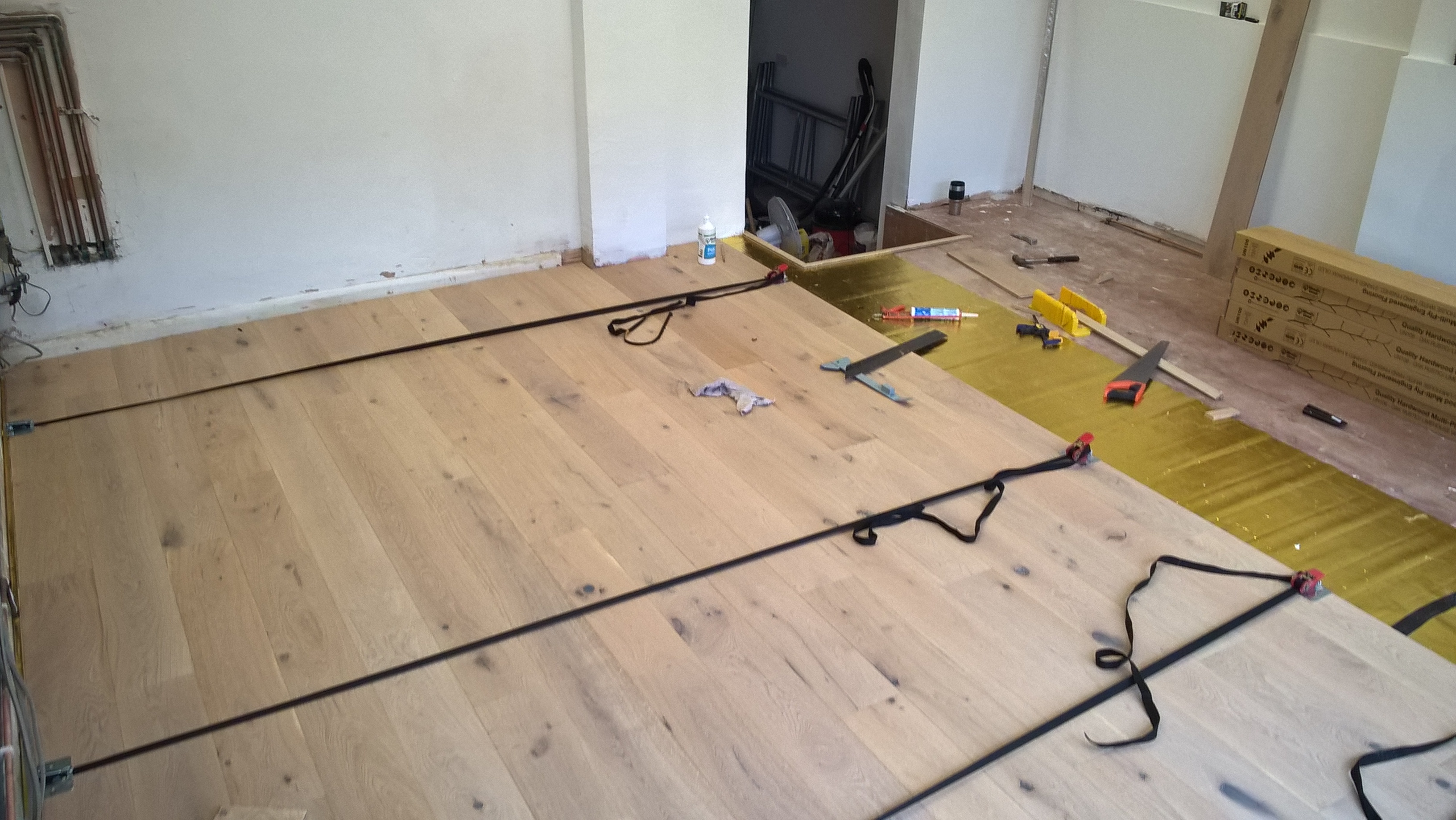 Solid wood flooring strapped together